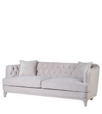 Edles Sofa mit großzügiger Polsterung, tiefer Knopfheftung und cremefarbenem Samtbezug